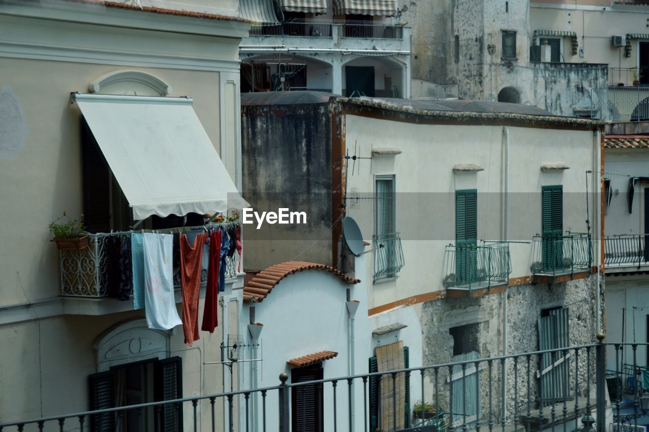 Clothes drying on balcony of building