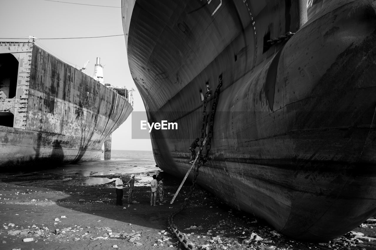 Abandoned boat  in shipyard against sky