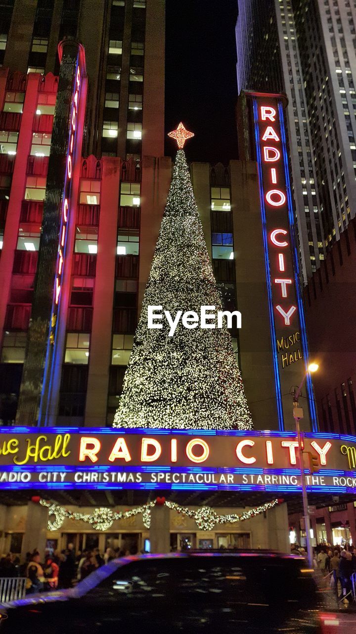 ILLUMINATED CHRISTMAS TREE IN CITY