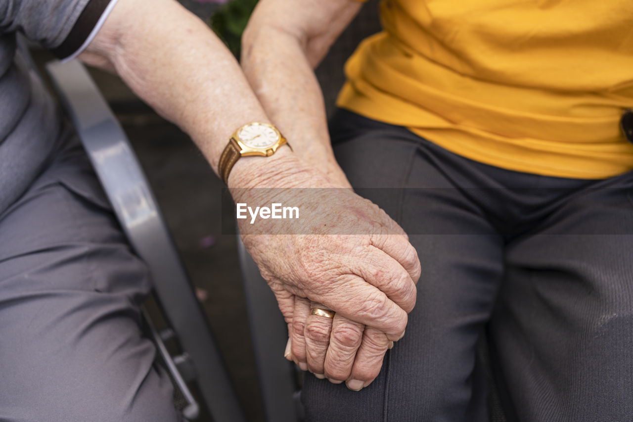 Senior couple holding hands