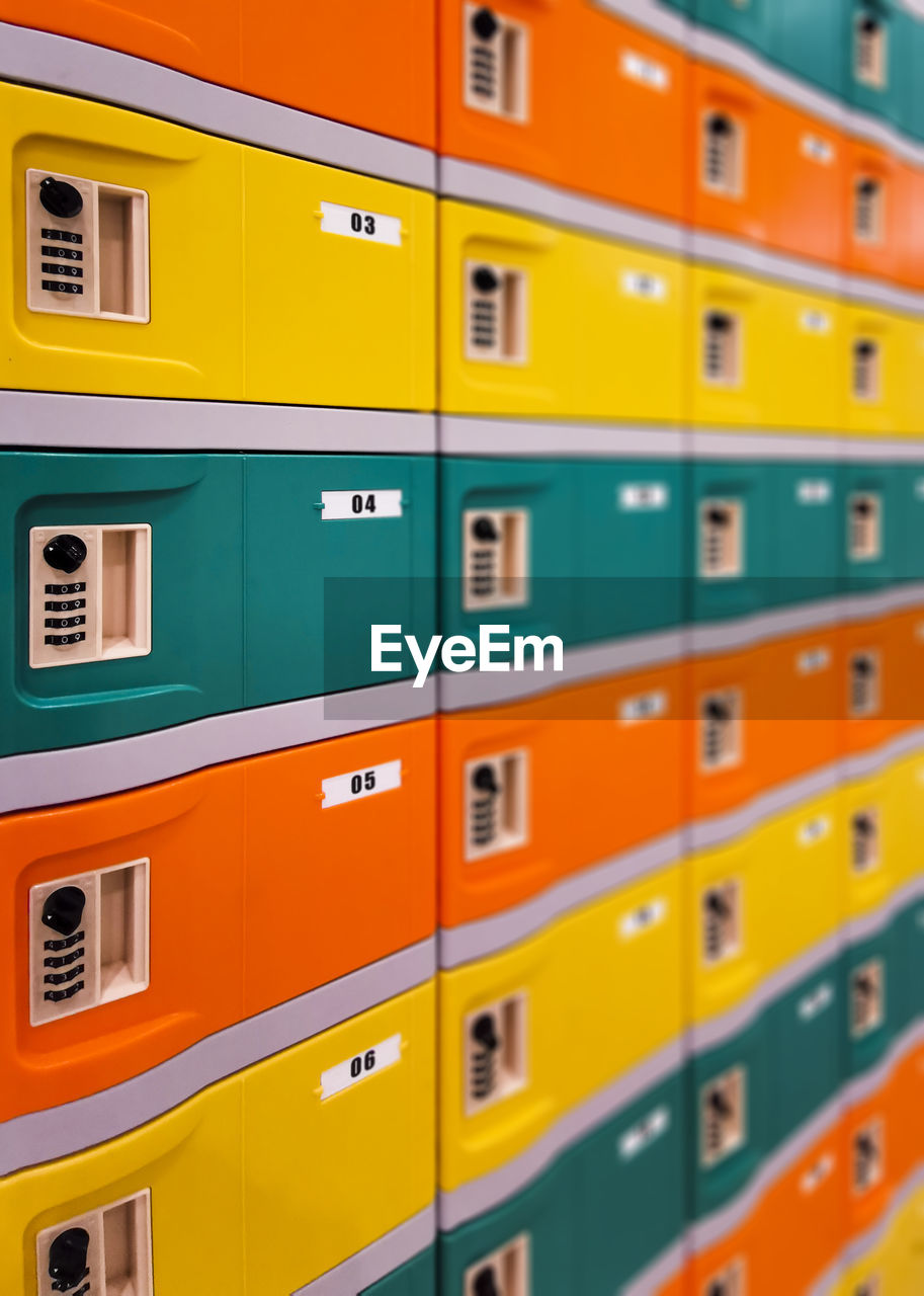 Full frame shot of multi colored yellow and green and orange safety boxes