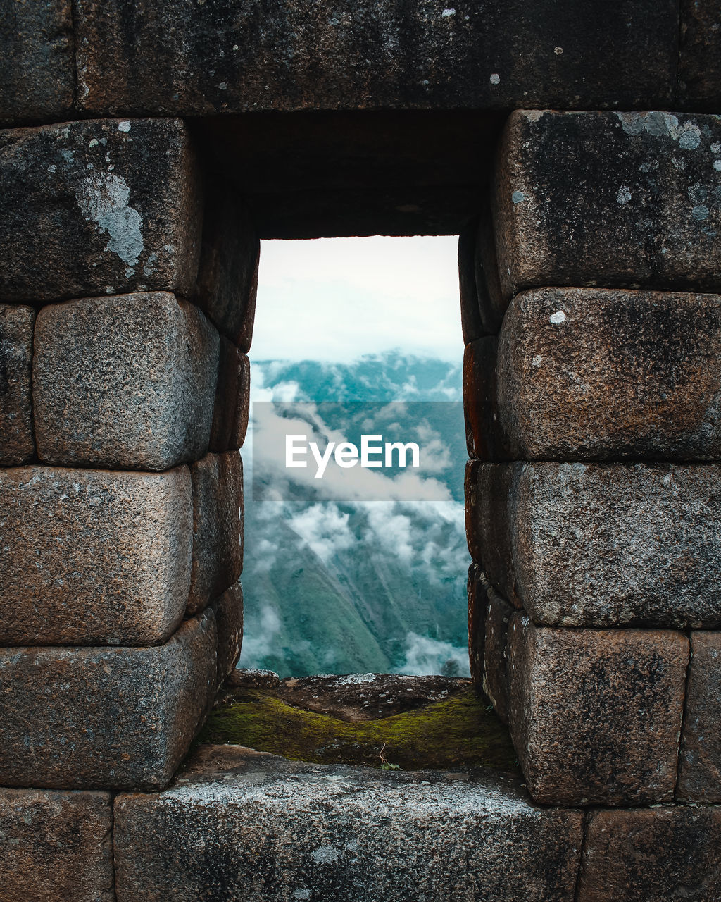 Mountain seen through window at machu picchu