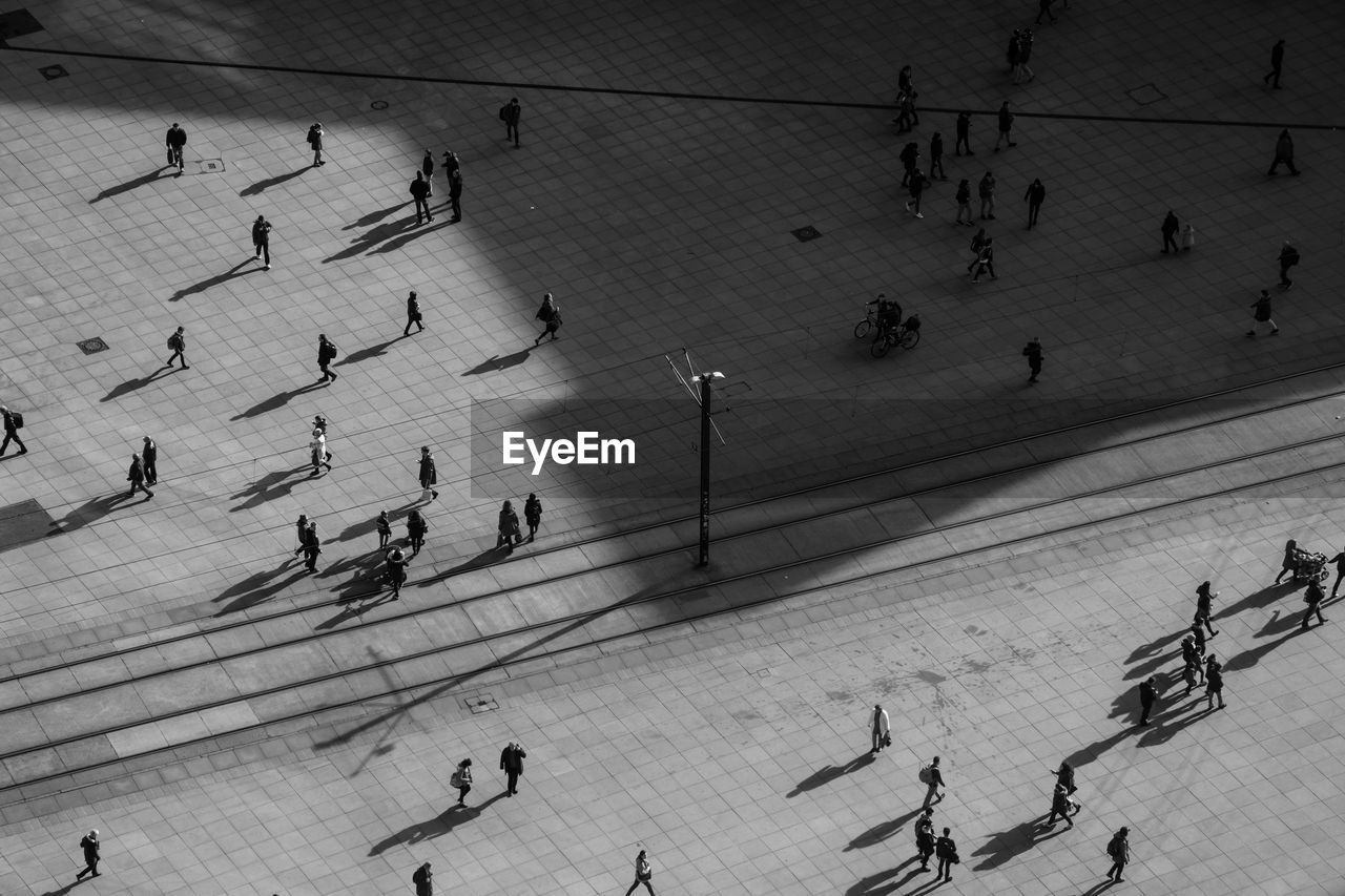 High angle view of people walking on footpath at alexanderplatz