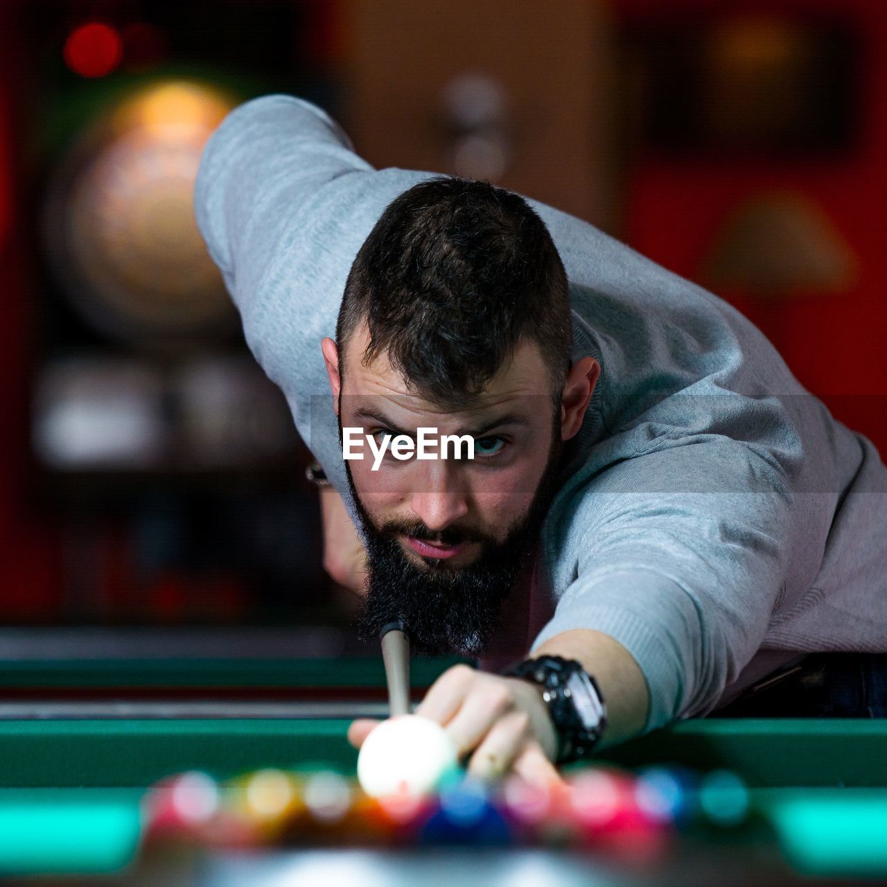 Young man playing snooker