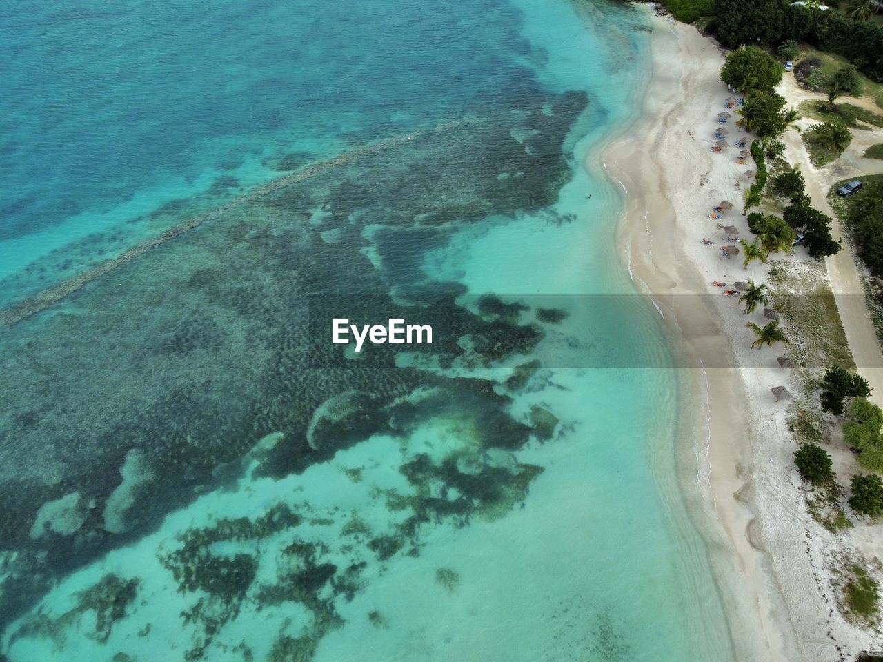 water, sea, land, beach, beauty in nature, scenics - nature, nature, high angle view, turquoise colored, reef, tranquility, aerial view, coast, tranquil scene, day, no people, idyllic, ocean, outdoors, sand, travel destinations, blue, lagoon, island, travel, coastline, islet, environment, cay, tree, bay, non-urban scene, plant, tourism, tropical climate, archipelago, shore, aerial photography, landscape