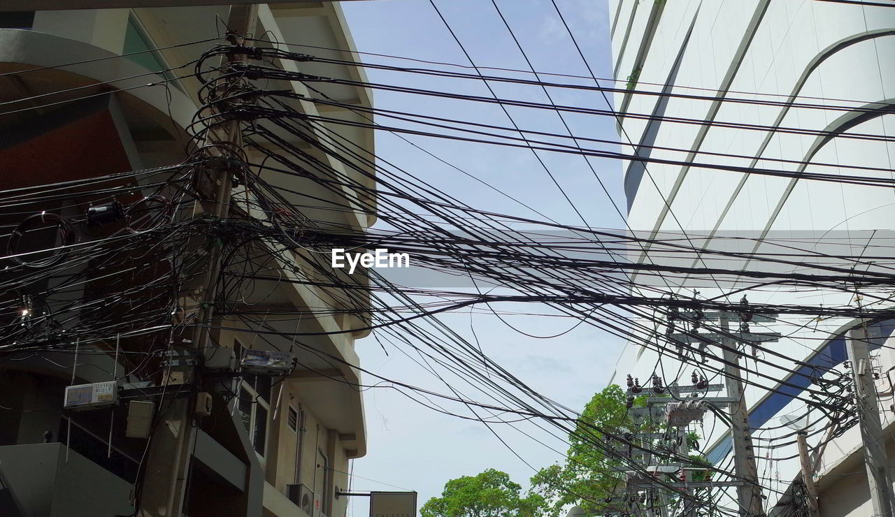 Low angle view of electric wire against sky