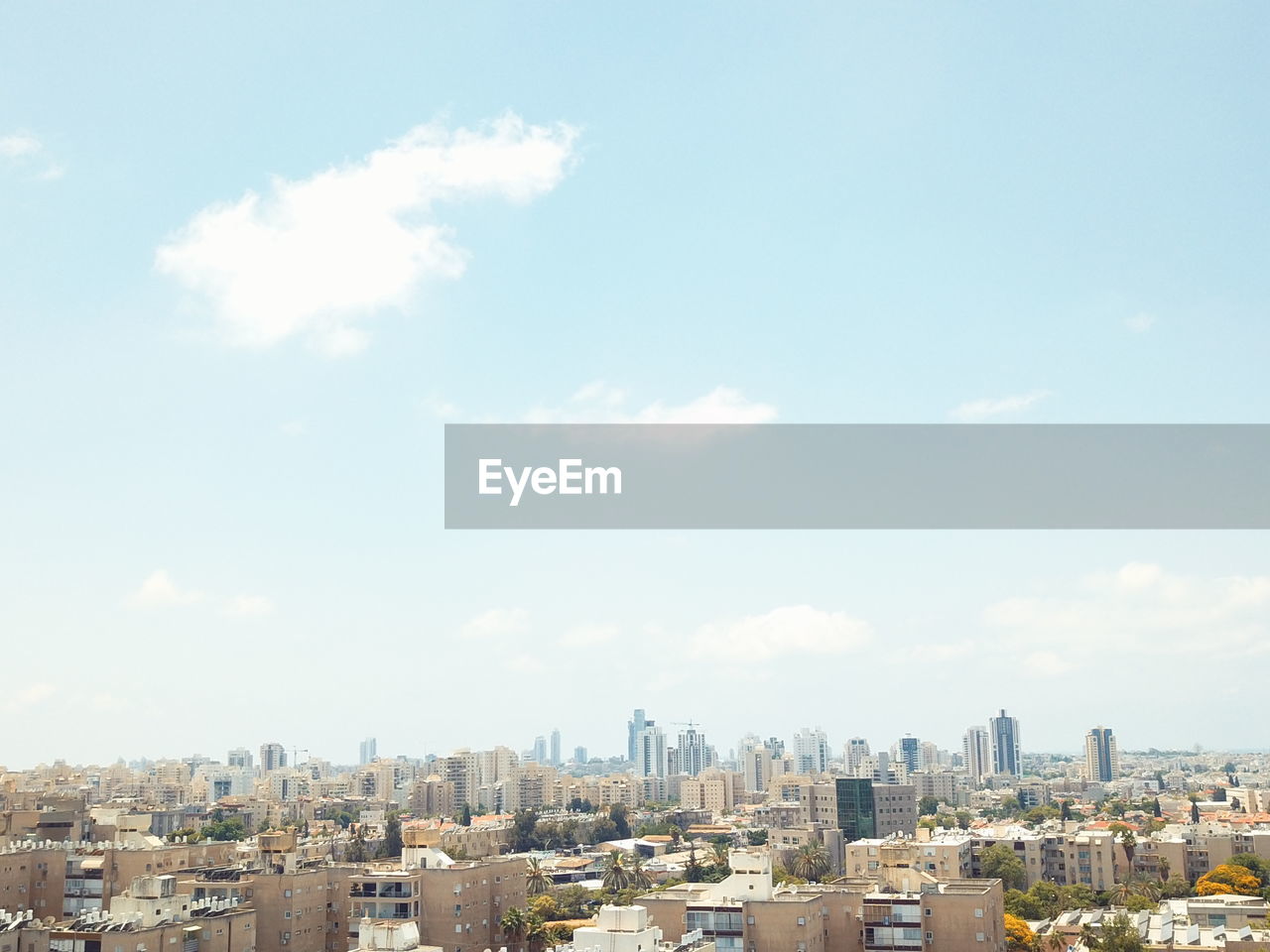 VIEW OF BUILDINGS IN CITY AGAINST SKY