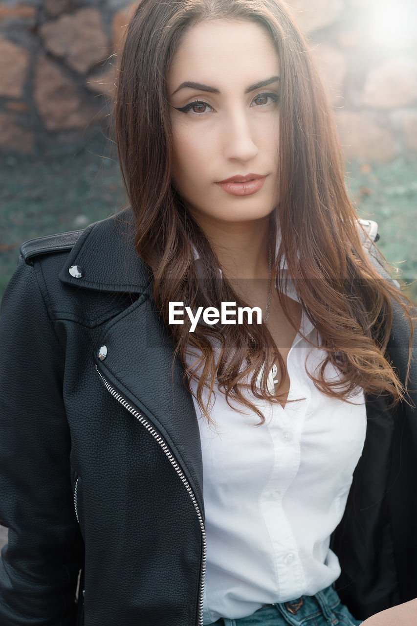 Portrait of beautiful woman standing outdoors