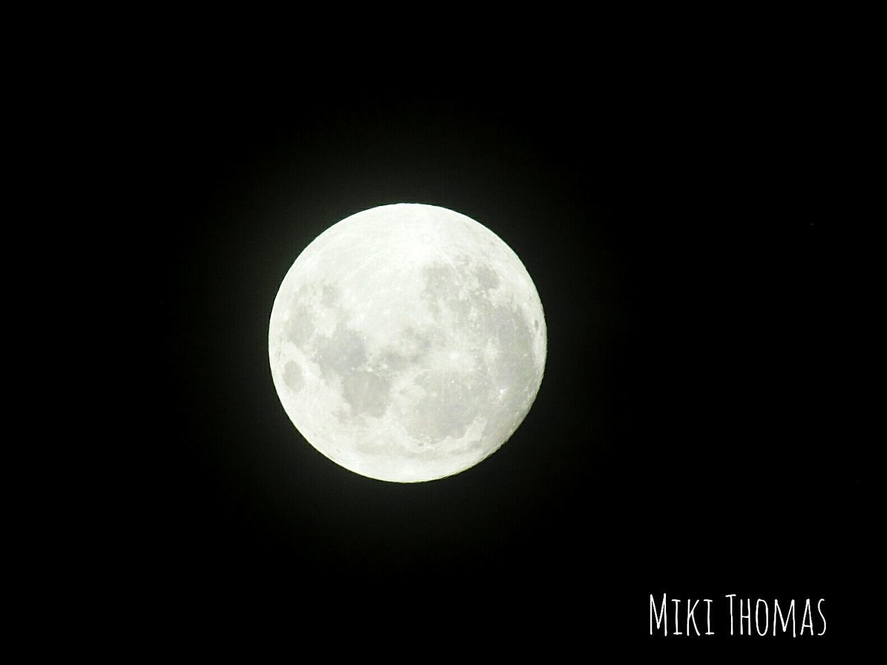 LOW ANGLE VIEW OF FULL MOON AGAINST BLACK SKY