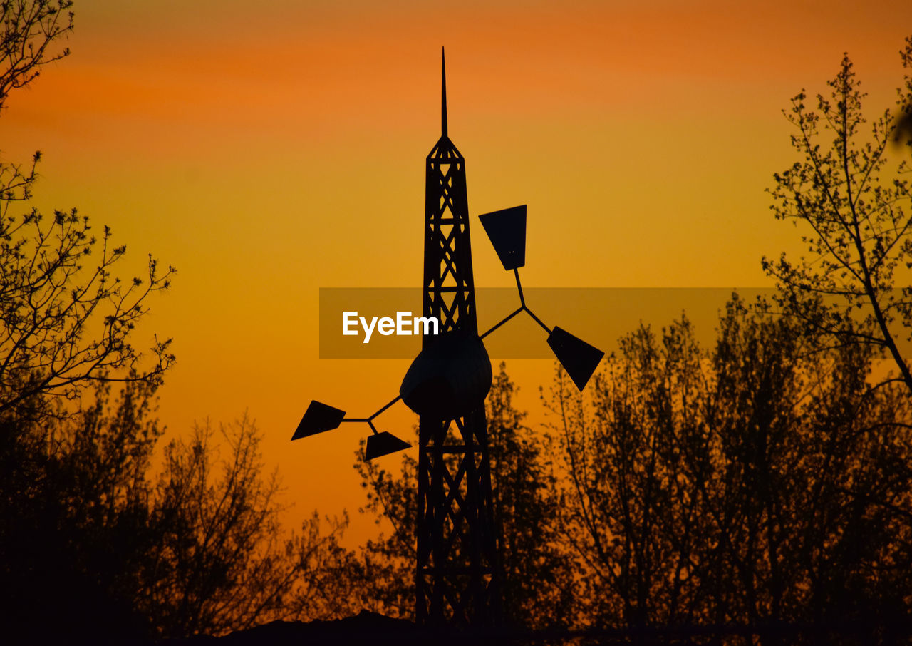 SILHOUETTE OF ROAD SIGN AGAINST SKY DURING SUNSET