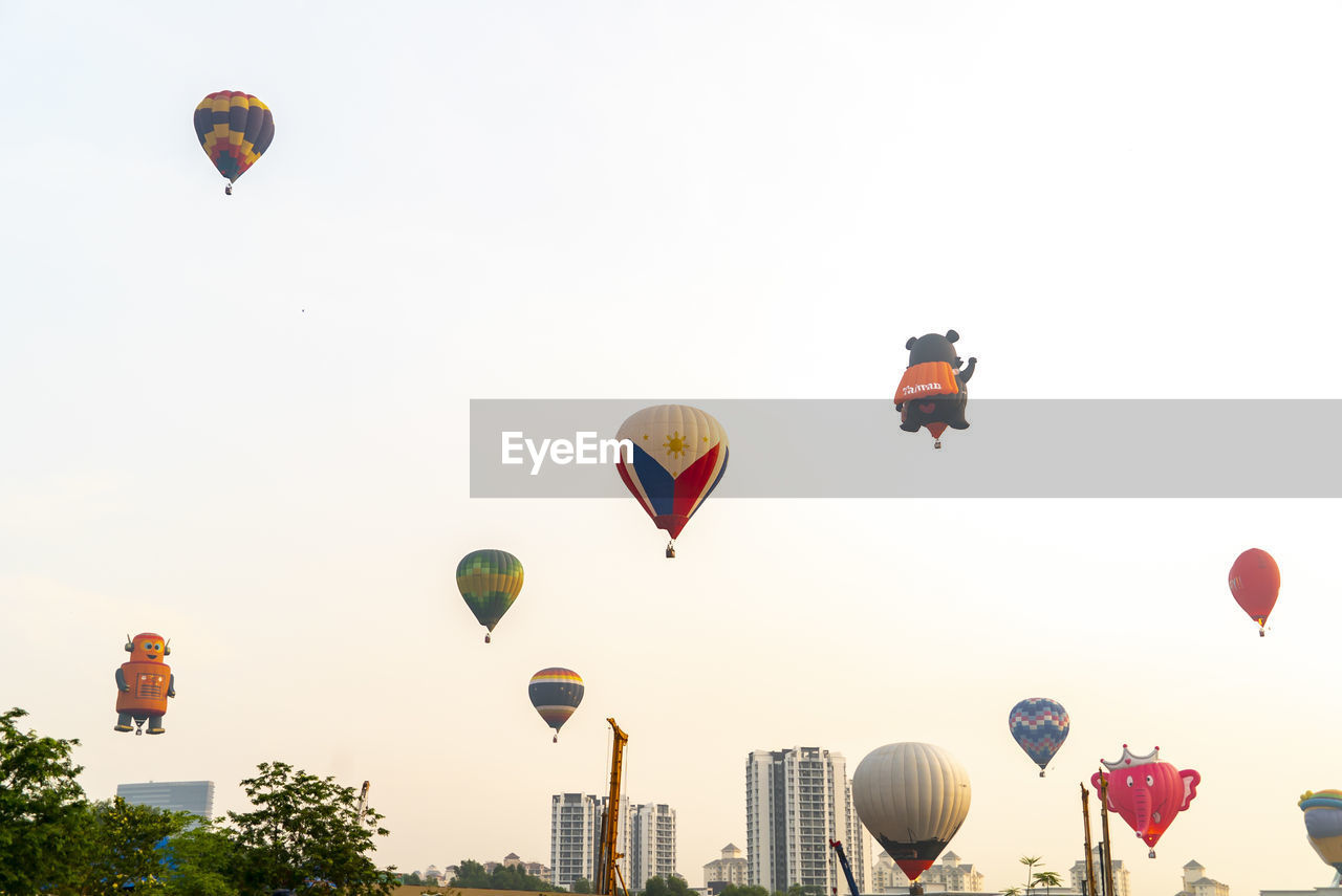 Low angle view of hot air balloons against sky