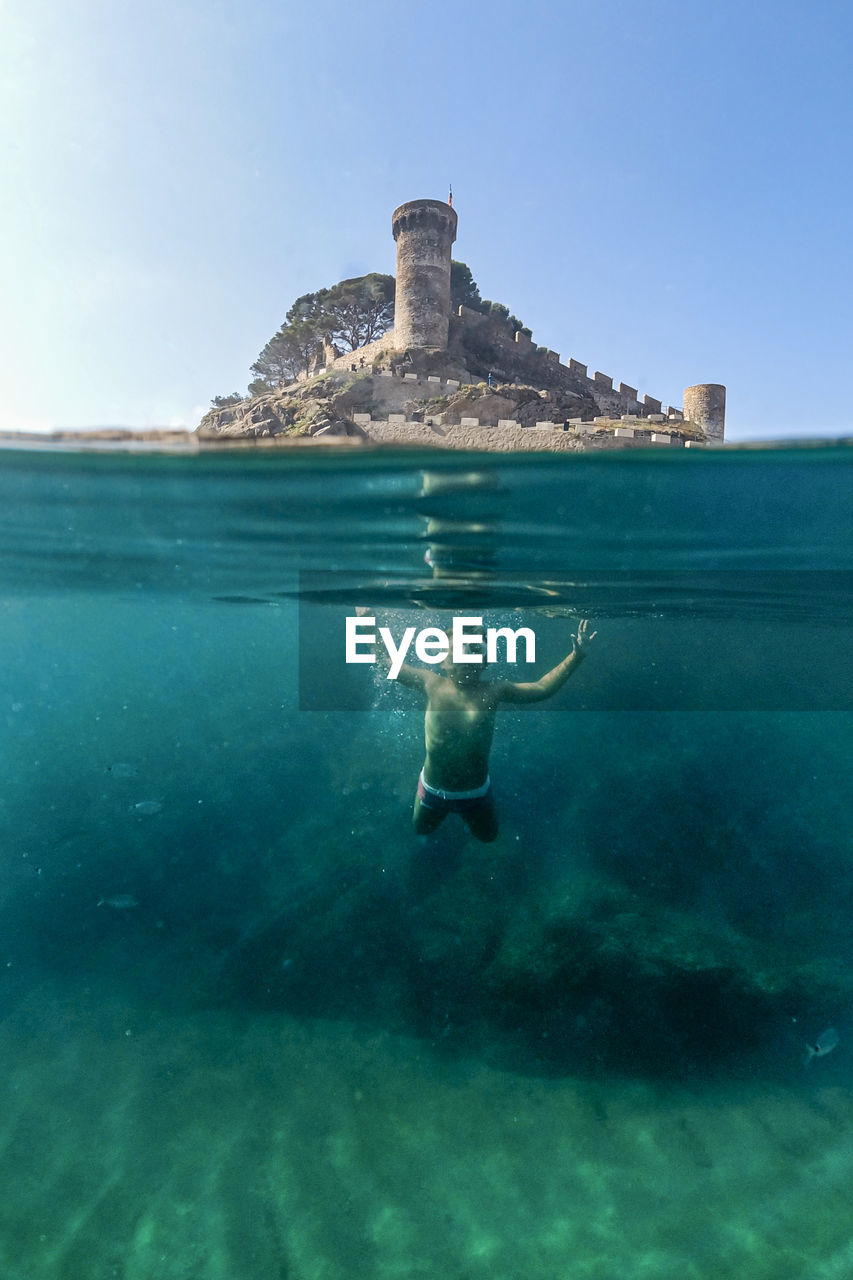 Man swimming in sea