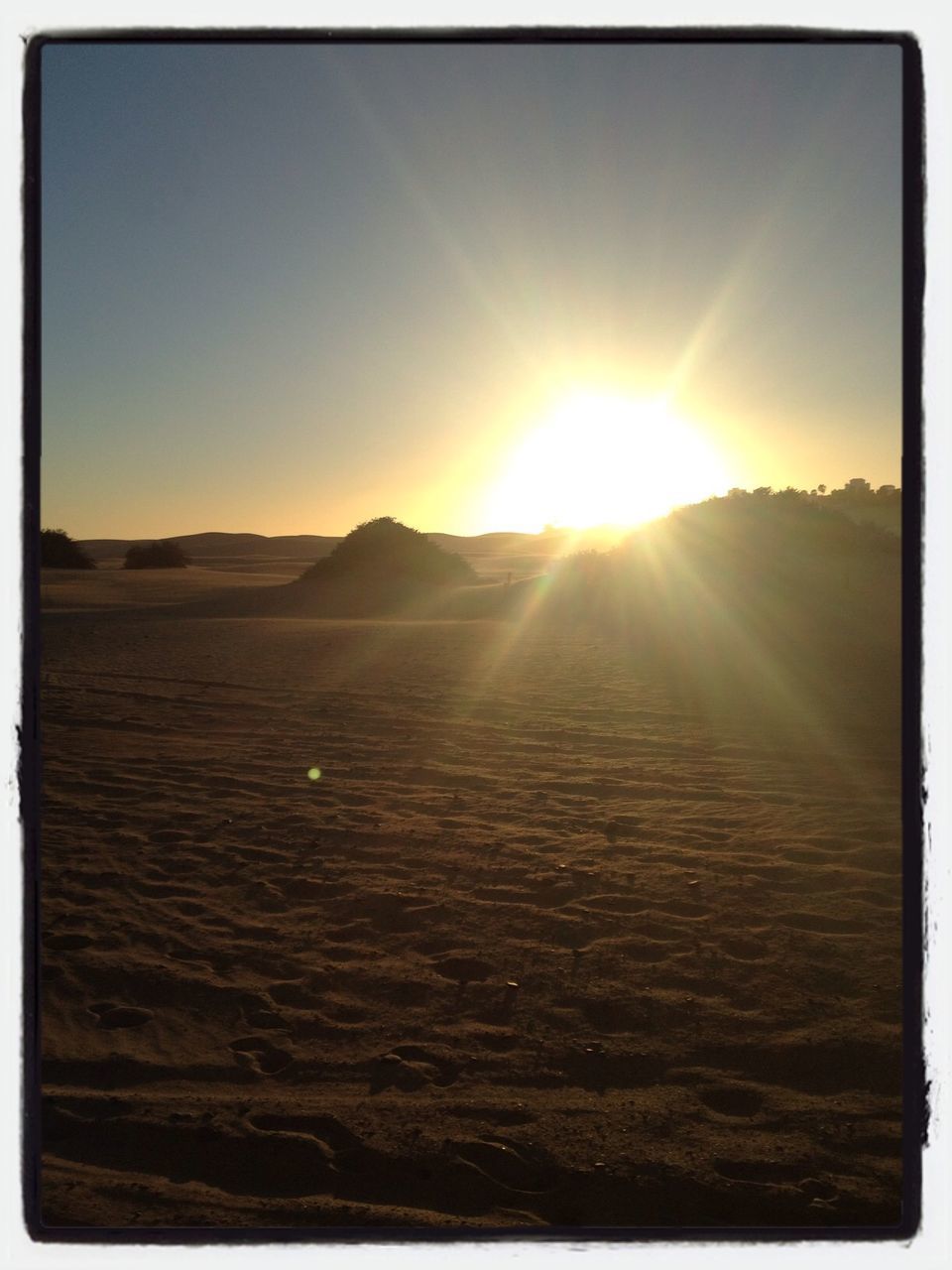 Desert against sky on sunny day