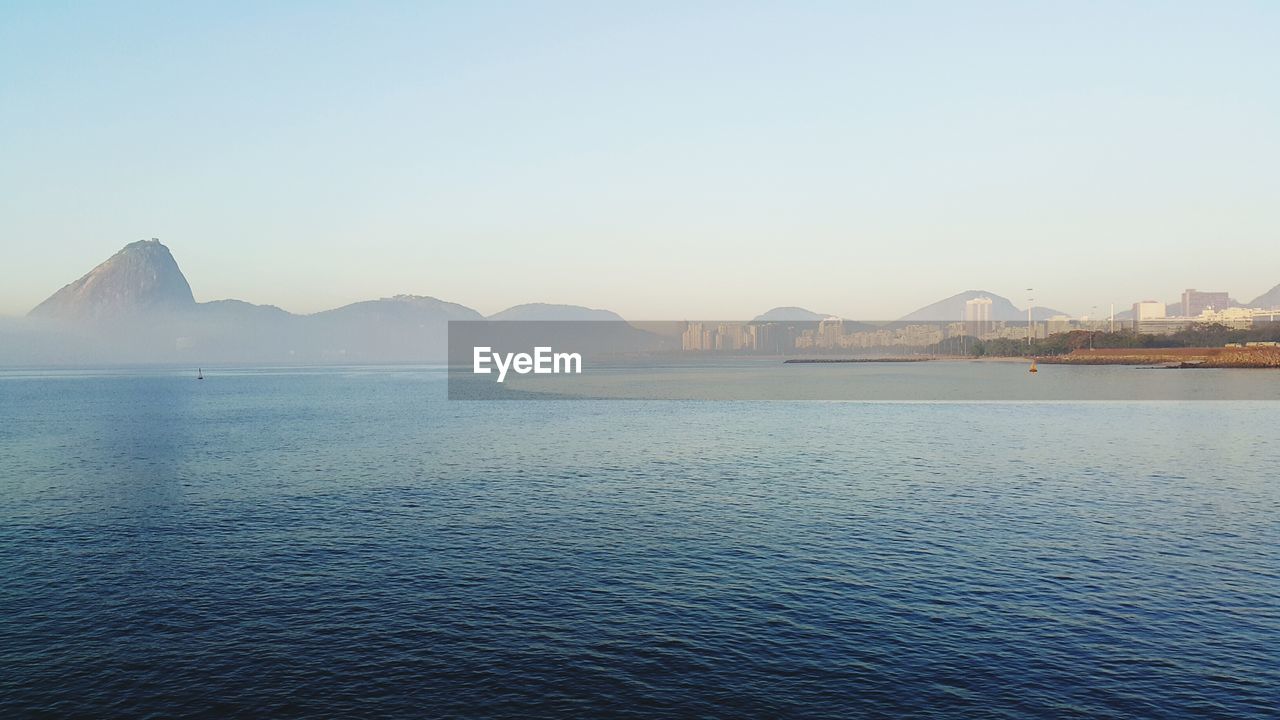 SCENIC VIEW OF MOUNTAINS AGAINST CLEAR SKY