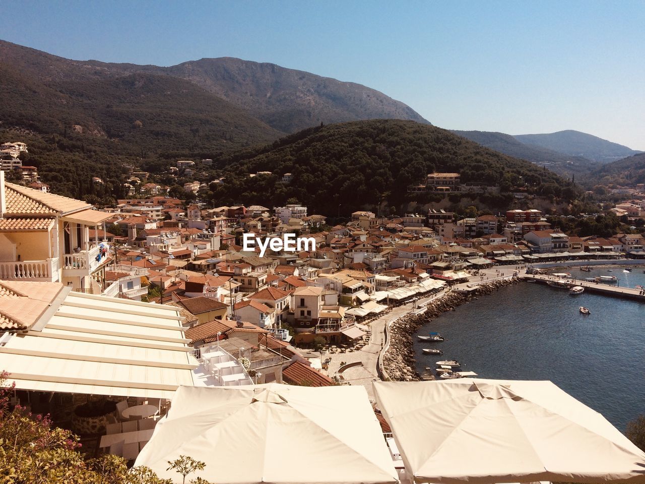 High angle view of townscape and mountains against sky