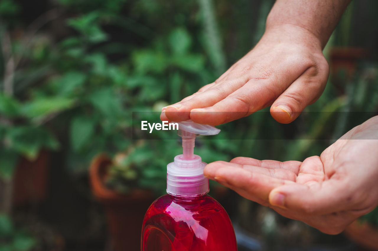 Close-up of hand using and oress antibacterial soap 