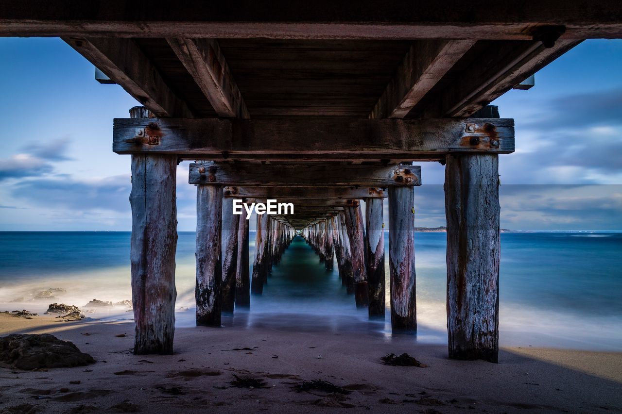 Pier over sea against sky