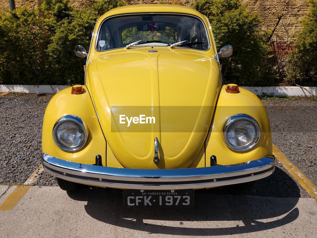 VIEW OF YELLOW CAR ON ROAD