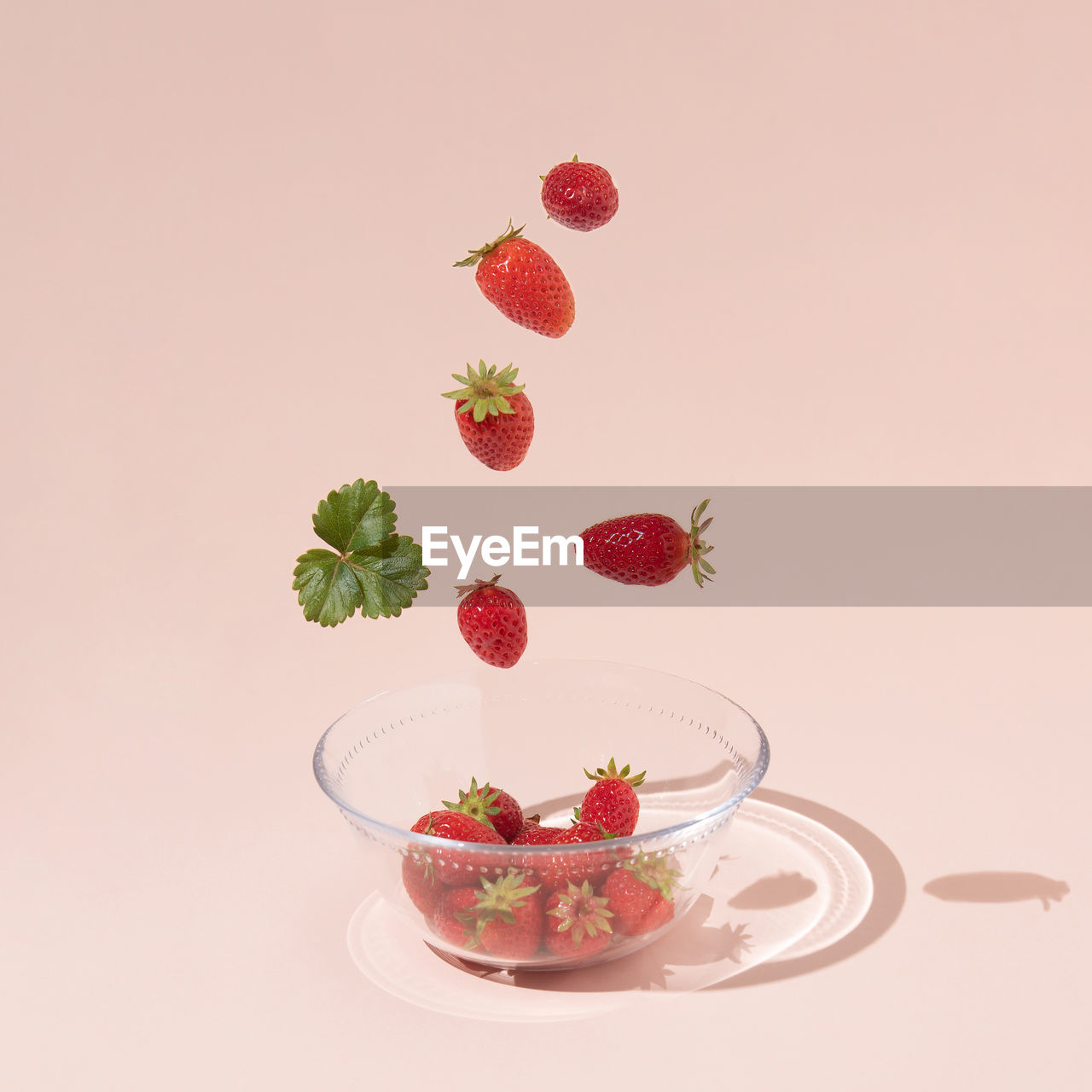 HIGH ANGLE VIEW OF RED BERRIES ON TABLE