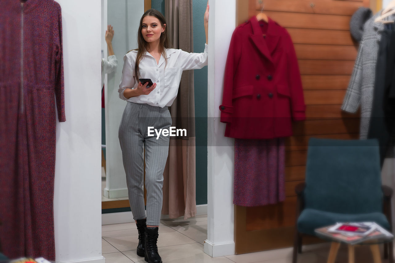 Portrait of woman standing in store