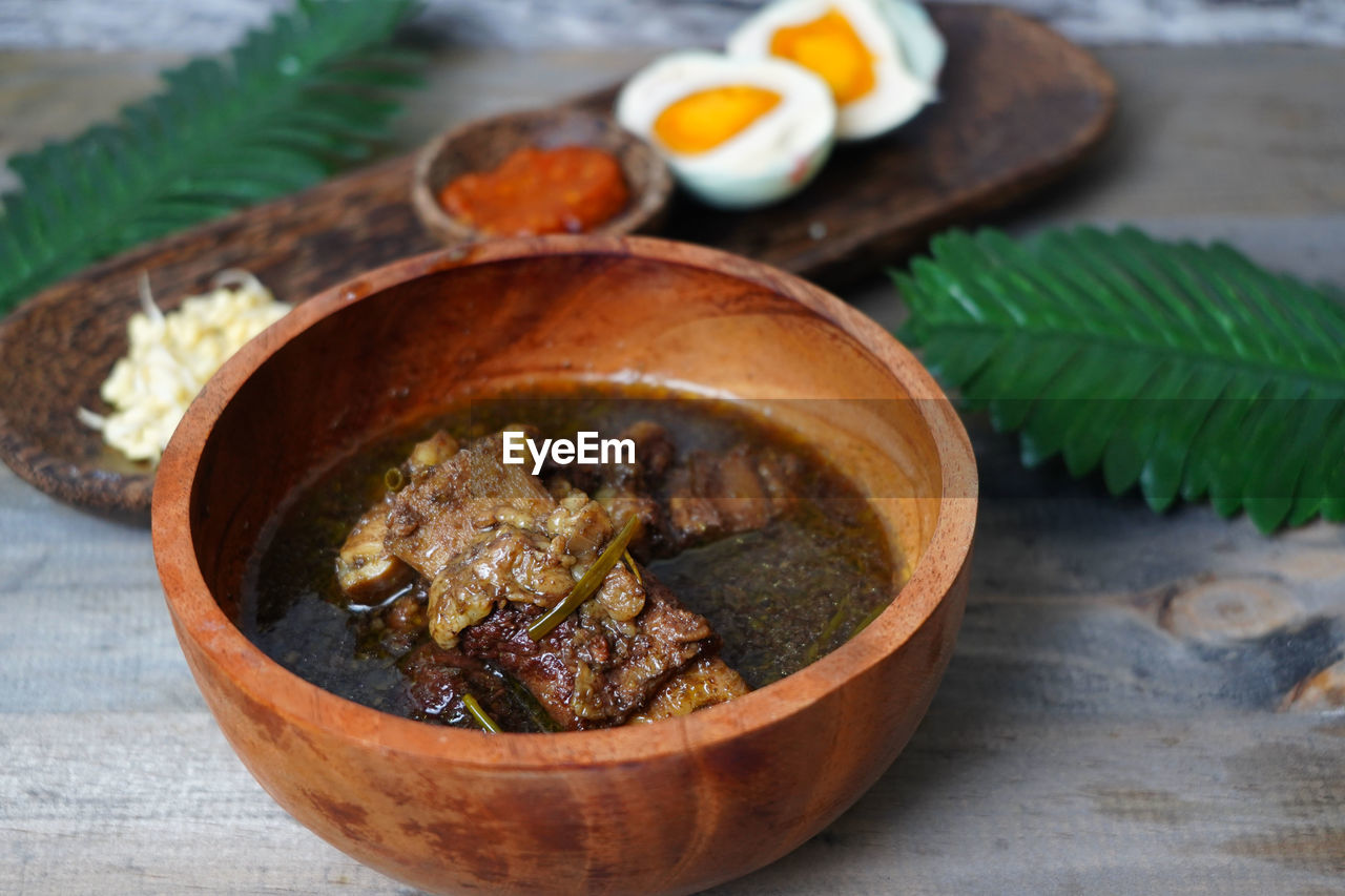 High angle view of ribs soup in bowl on table