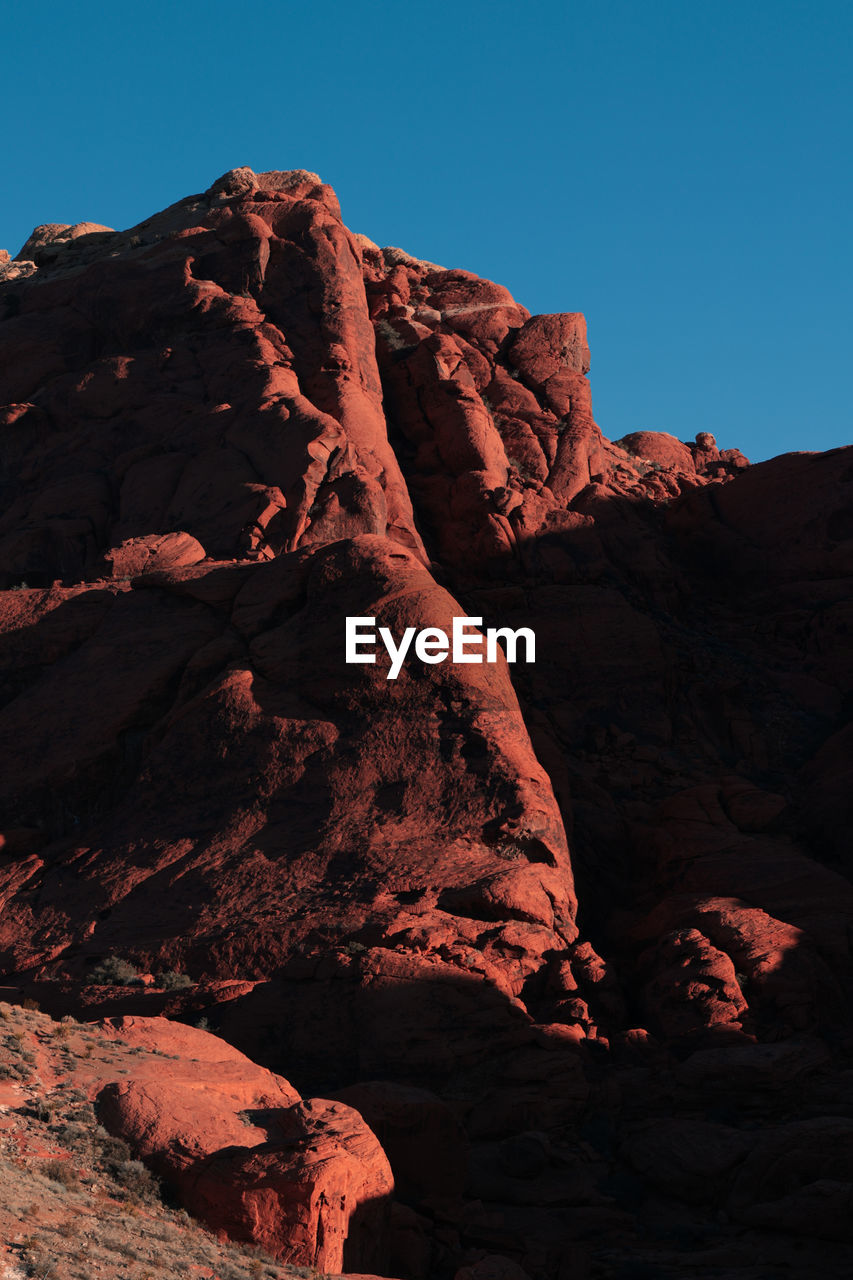 low angle view of rock formations against clear sky