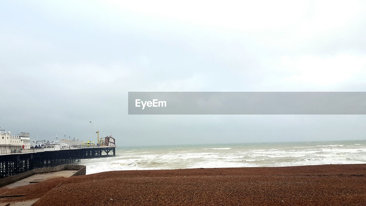 View of pier and sea against sky