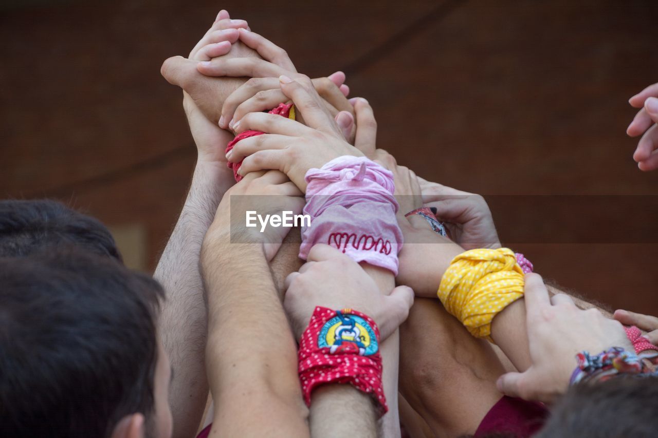 Close-up of cropped hands during traditional festival