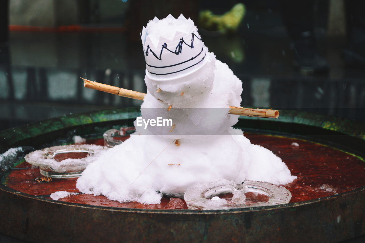 Close-up of snowman on table