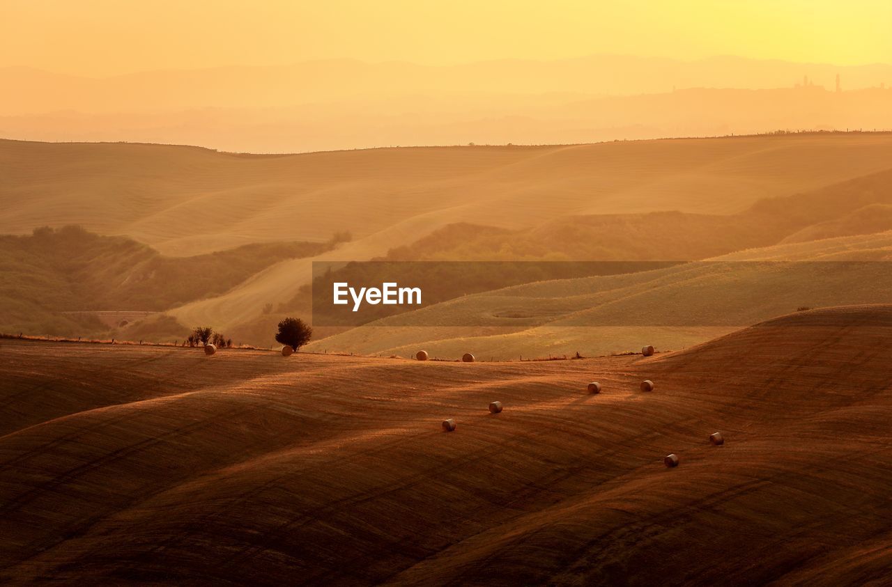 Scenic view of landscape against sky during sunset