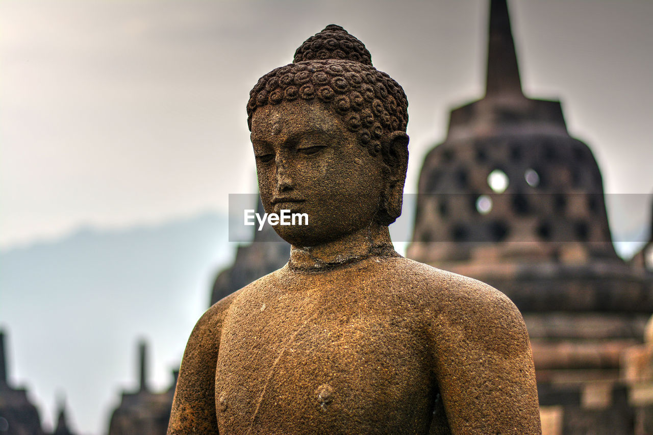 Close-up of buddha statue at borobudur temple