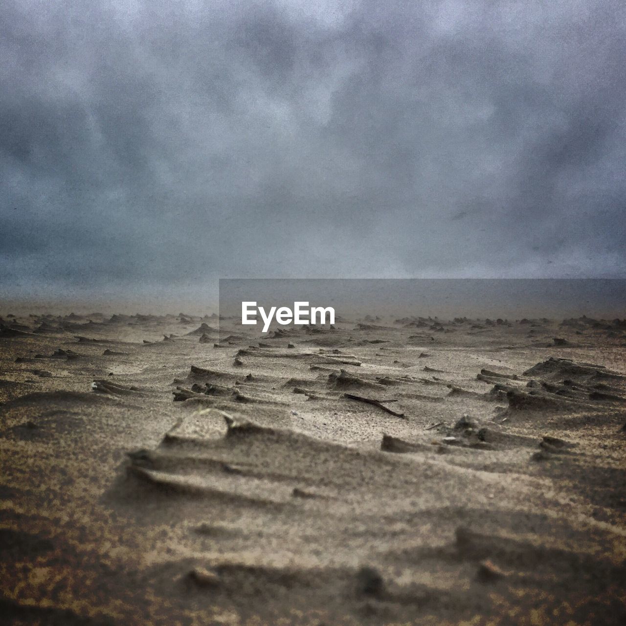 VIEW OF SAND DUNES AGAINST SKY