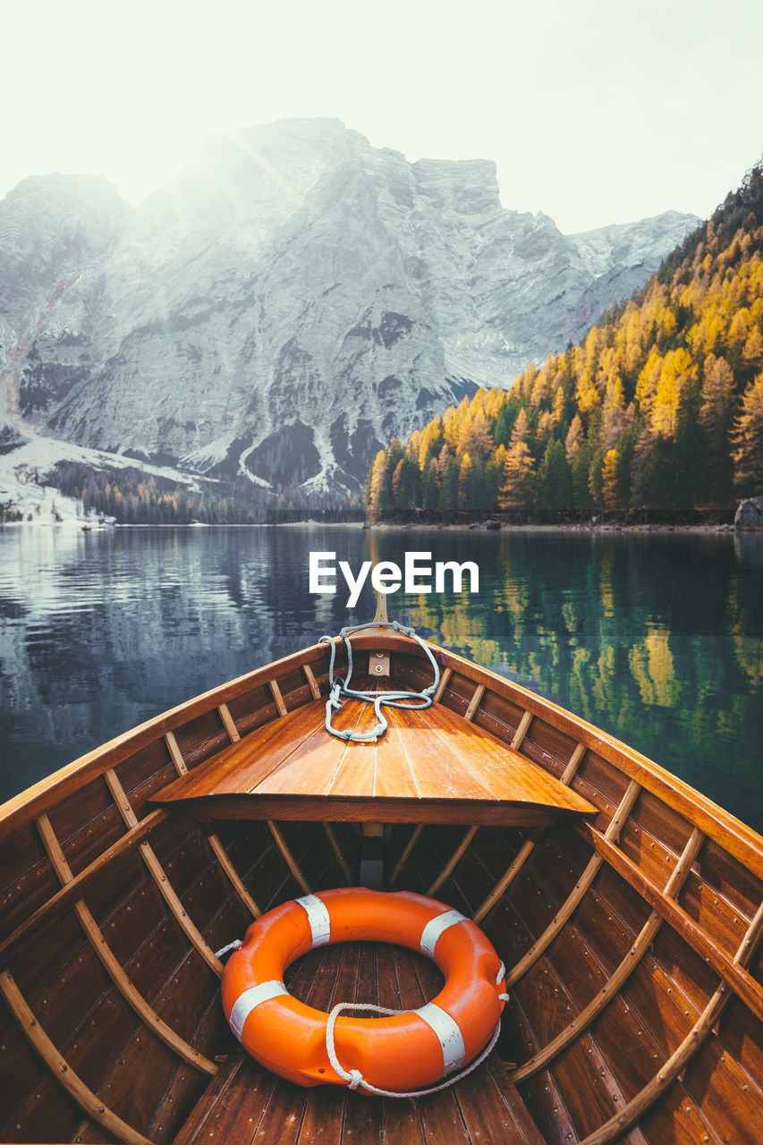 Boat on lake against mountain