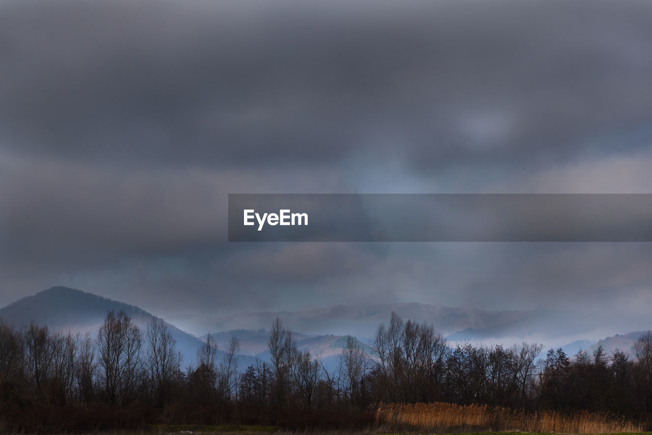 STORM CLOUDS OVER LAND