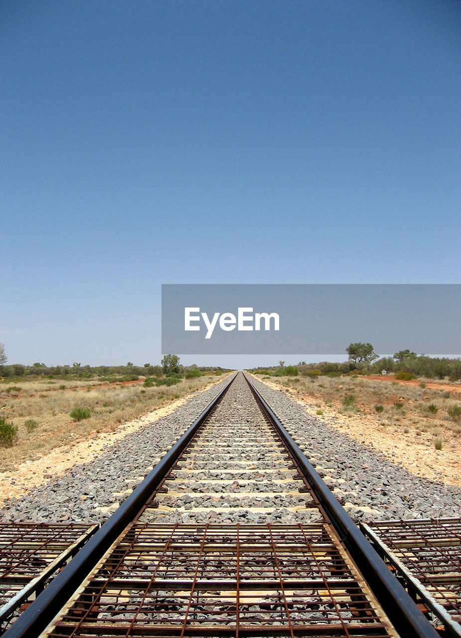 VIEW OF RAILROAD TRACKS AGAINST SKY