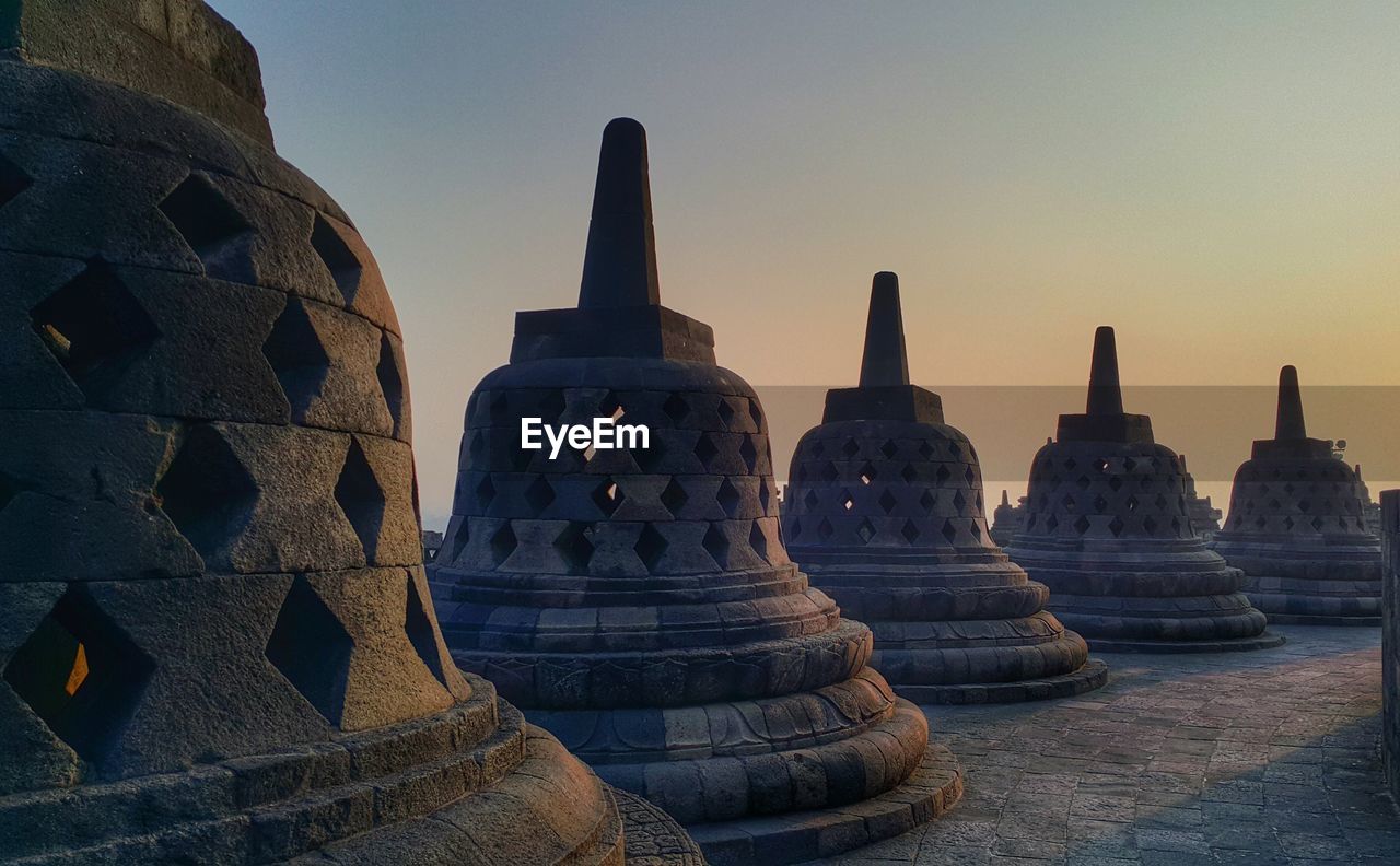 Stupas at borobudur against sky