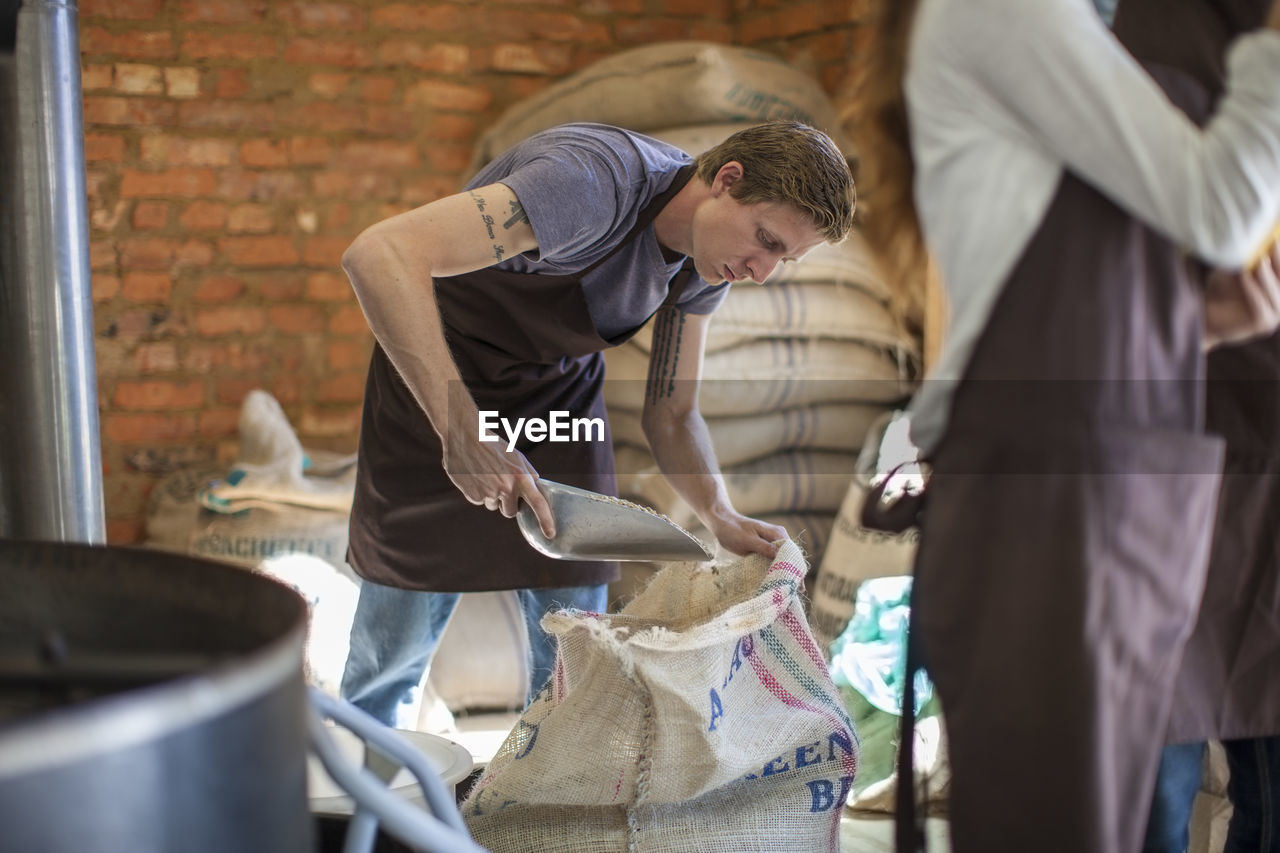 Coffee roaster with sack of beans