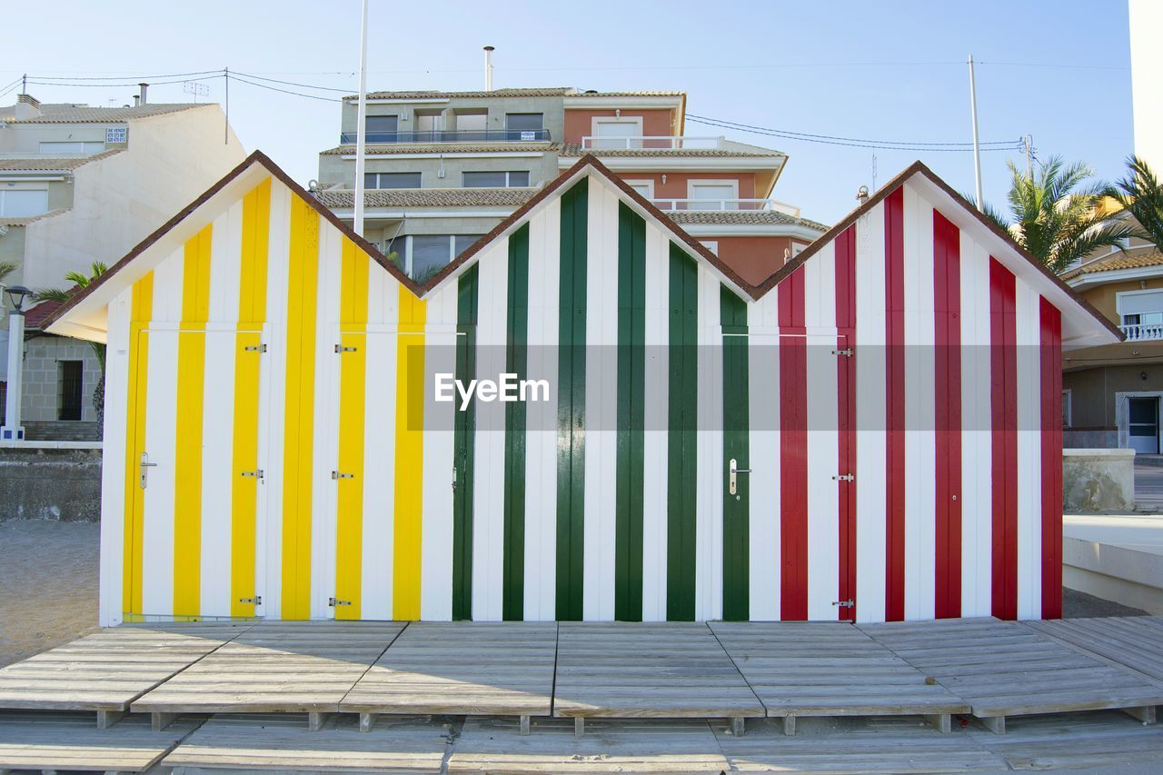 Built structure on beach against clear sky