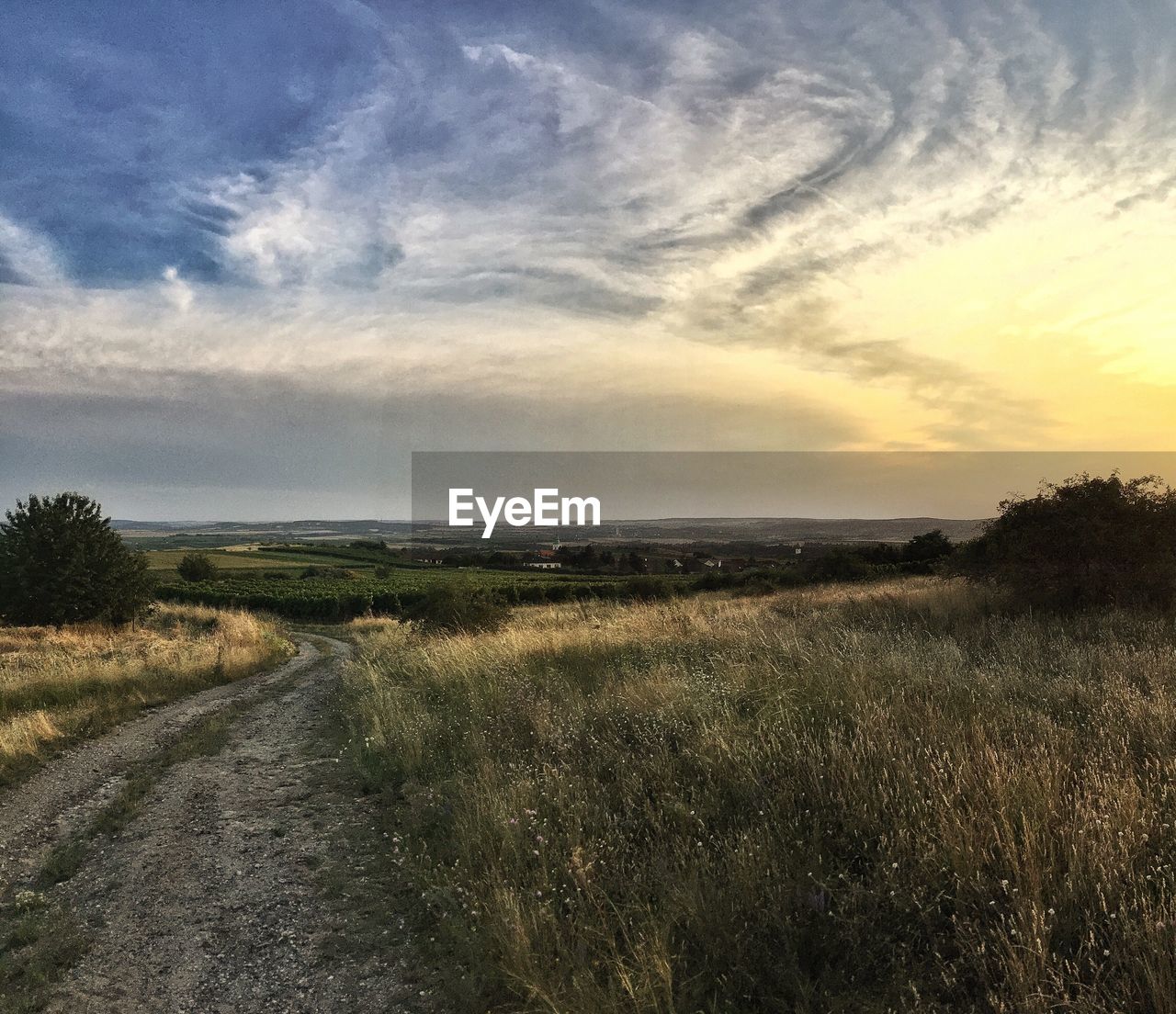 VIEW OF LANDSCAPE AGAINST CLOUDY SKY