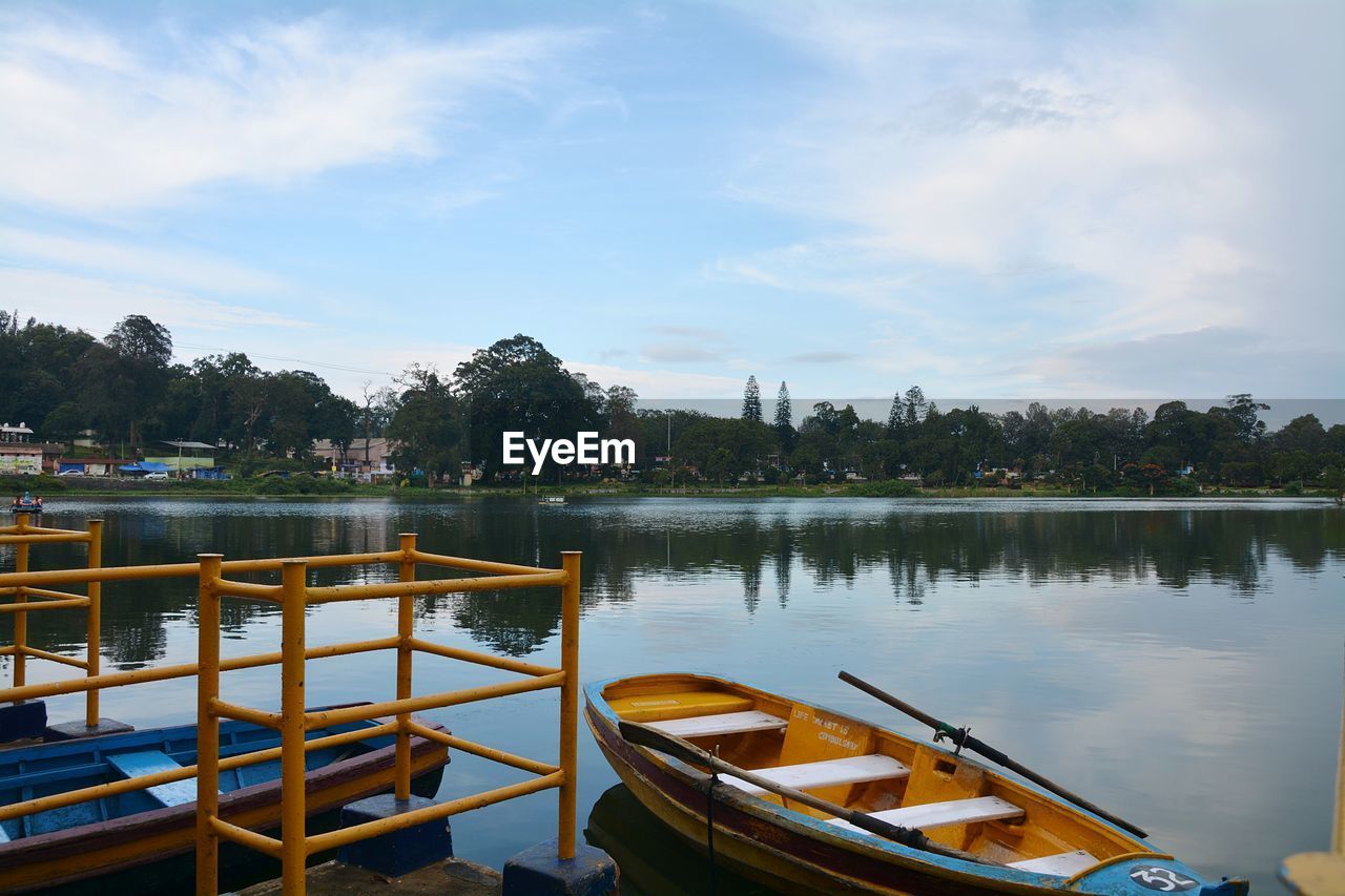 BOATS MOORED AT RIVERBANK