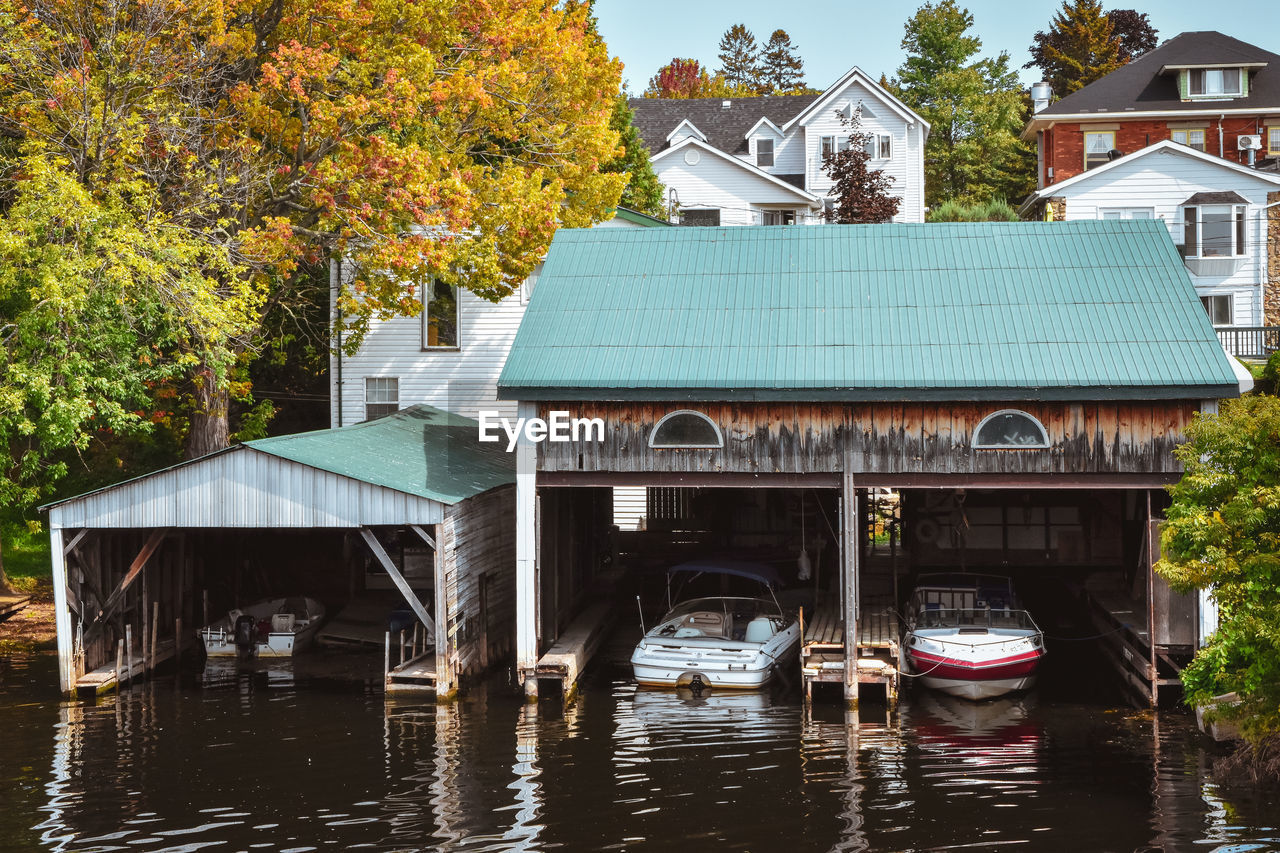 Boat cottage dock. lake ontario in autumn. colorful vivid trees. canada, united states of america.