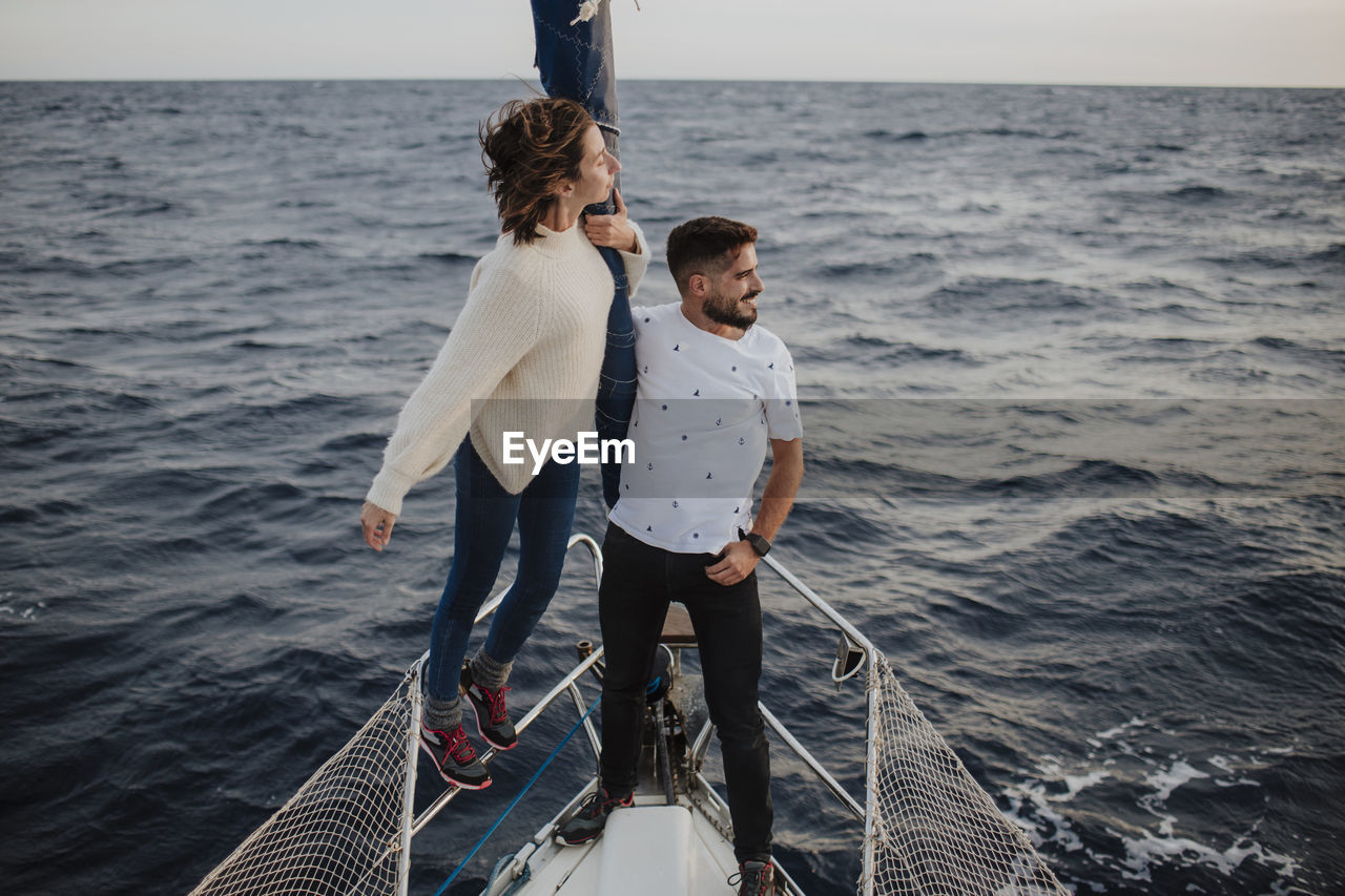 Couple enjoying vacation on boat in sea