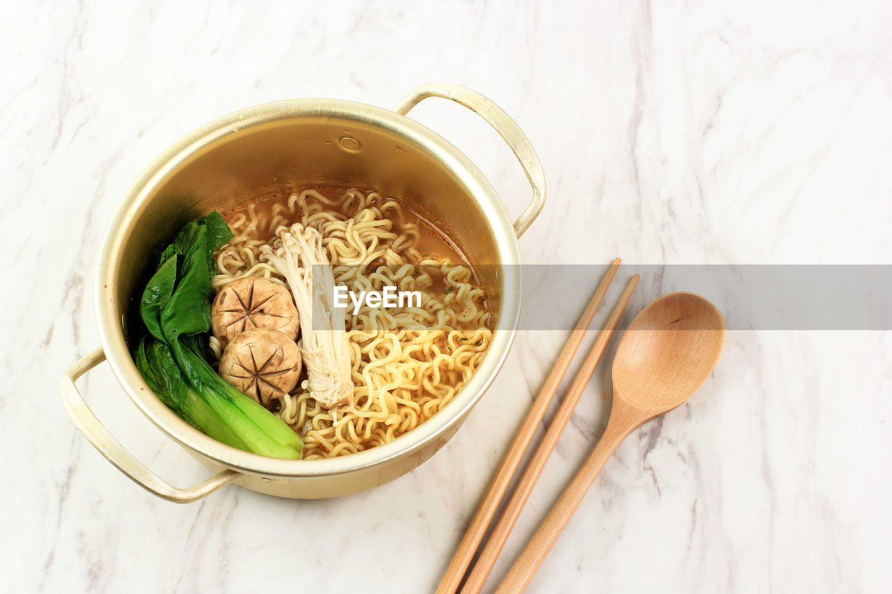 Korean style instant noodle, ramyeon or ramyun with spicy flavour topped 