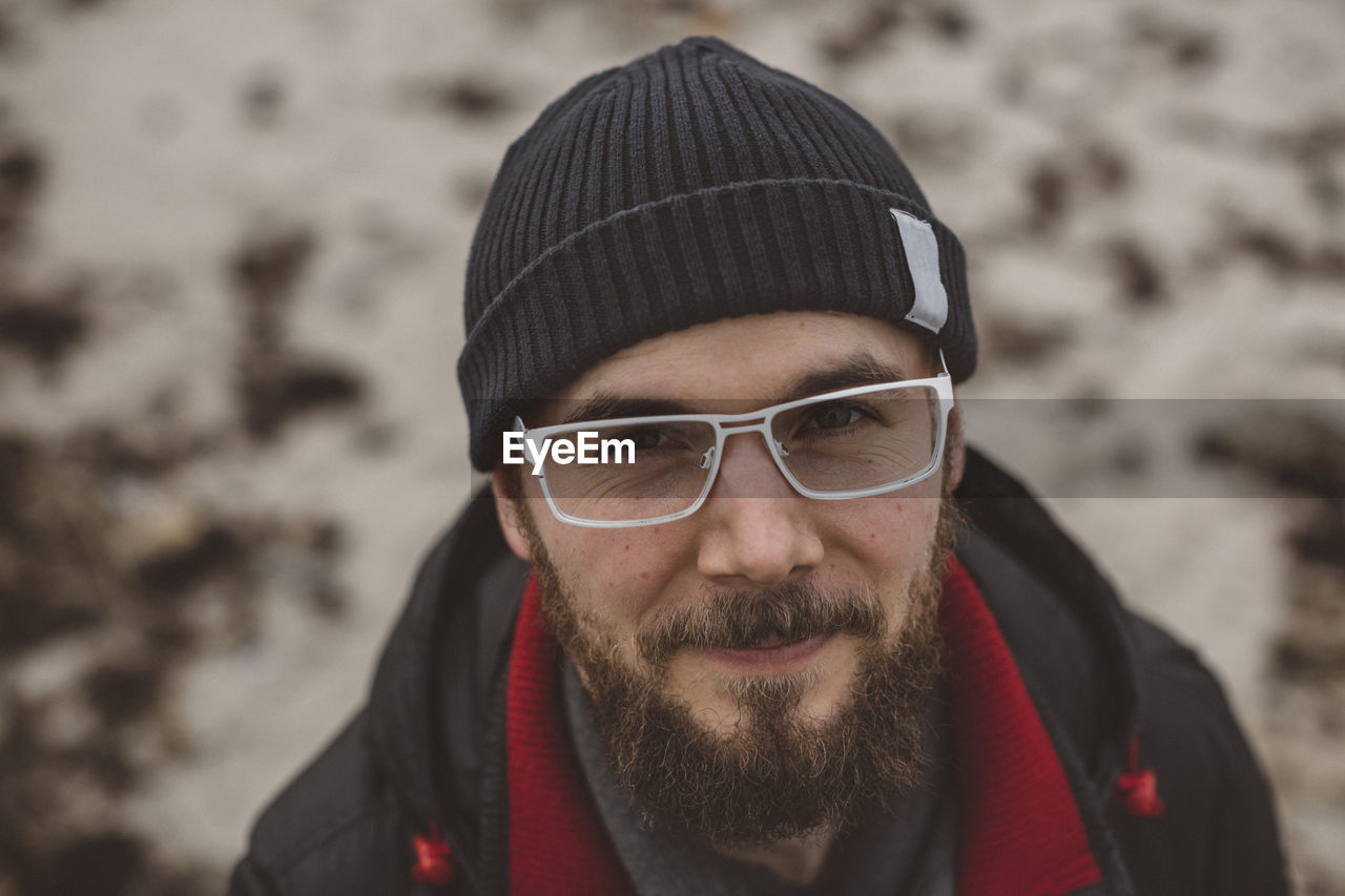 Portrait of young bearded man wearing glasses