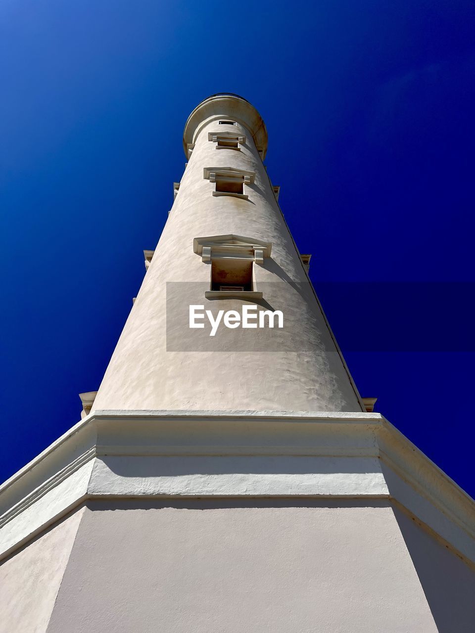 architecture, blue, built structure, building exterior, tower, landmark, sky, no people, lighthouse, clear sky, building, monument, low angle view, travel destinations, nature, history, travel, the past, religion, sunny, outdoors, belief, day, place of worship, tourism