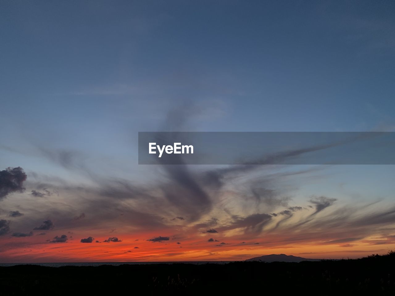 Scenic view of silhouette landscape against sky during sunset