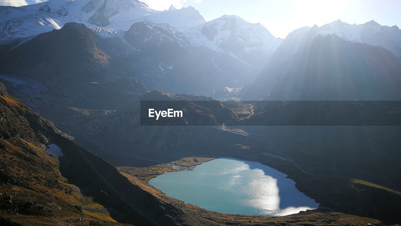 Panoramic view of mountains and a lake against sky