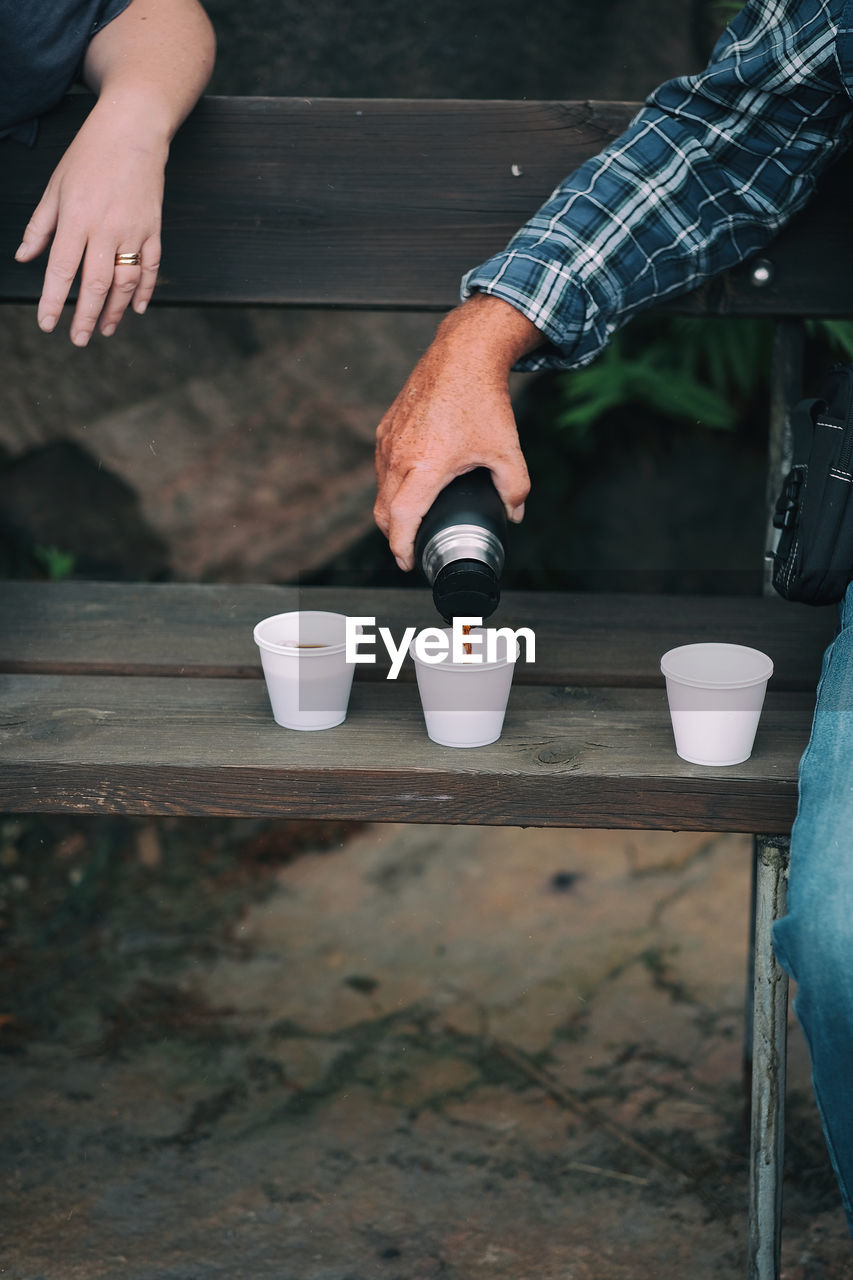 Cropped image of friends having drink