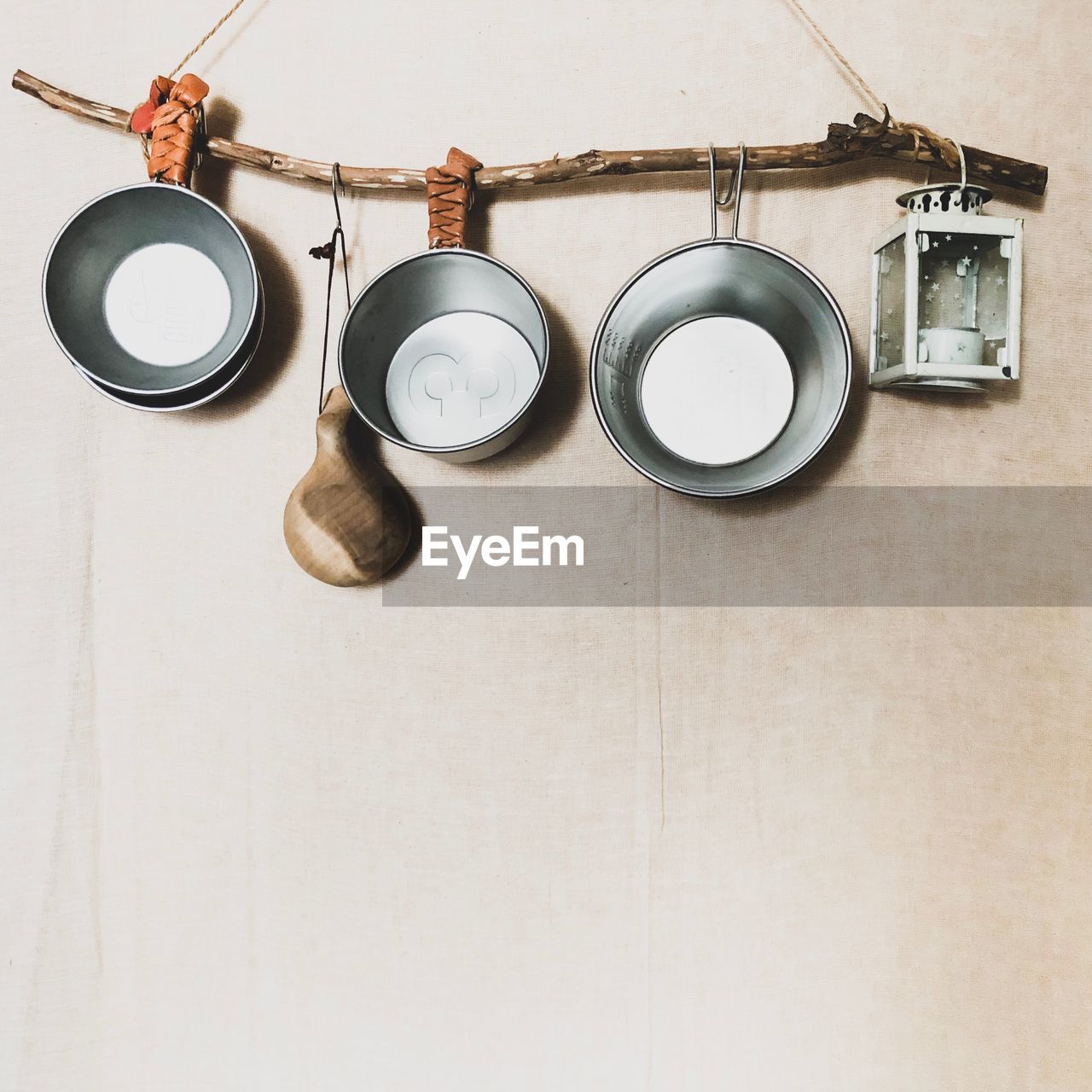 Low angle view of kitchen utensils hanging on wall