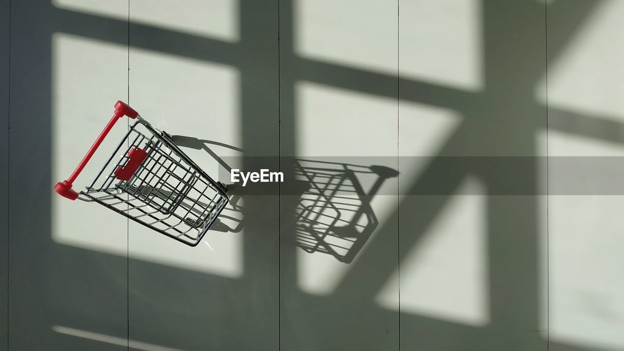 Empty trolley on a white background with window shadow